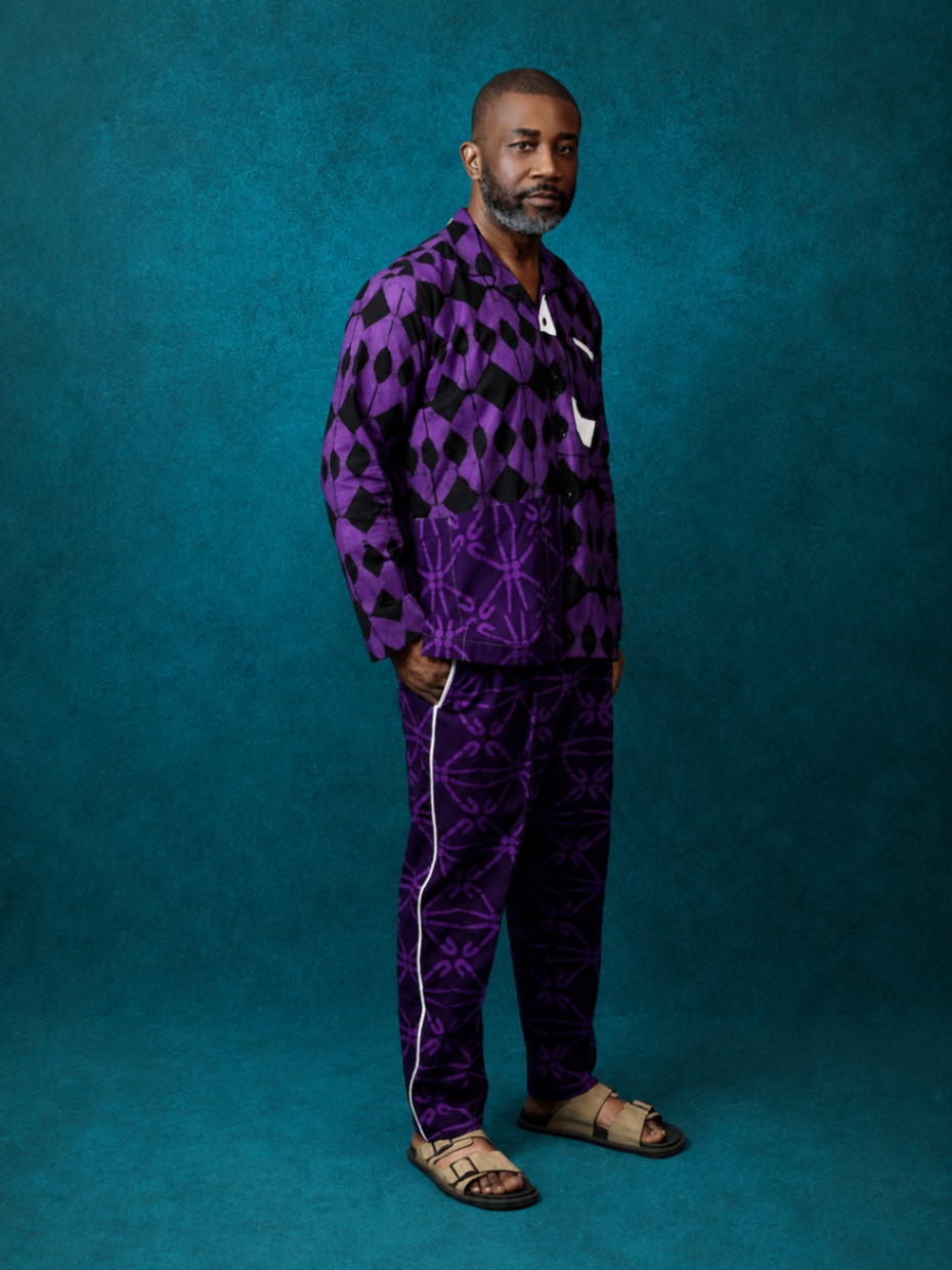 Model wearing an OBIDA purple lounge set against a teal studio backdrop.